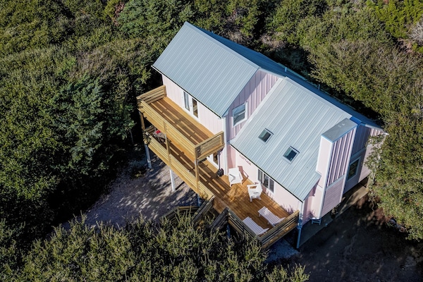 Pink house. New Polywood furniture. Railings have been painted white