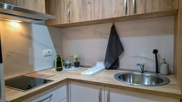 Microwave, coffee/tea maker, cookware/dishes/utensils, paper towels