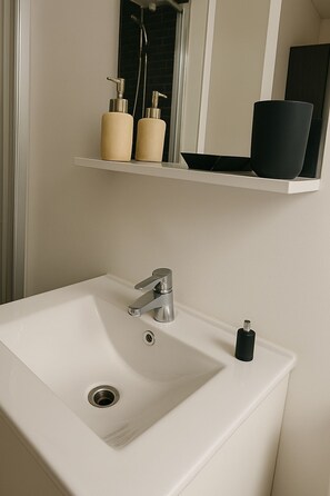 Shower, hair dryer, towels, soap
