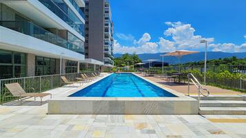 Indoor pool, outdoor pool, pool umbrellas, pool loungers