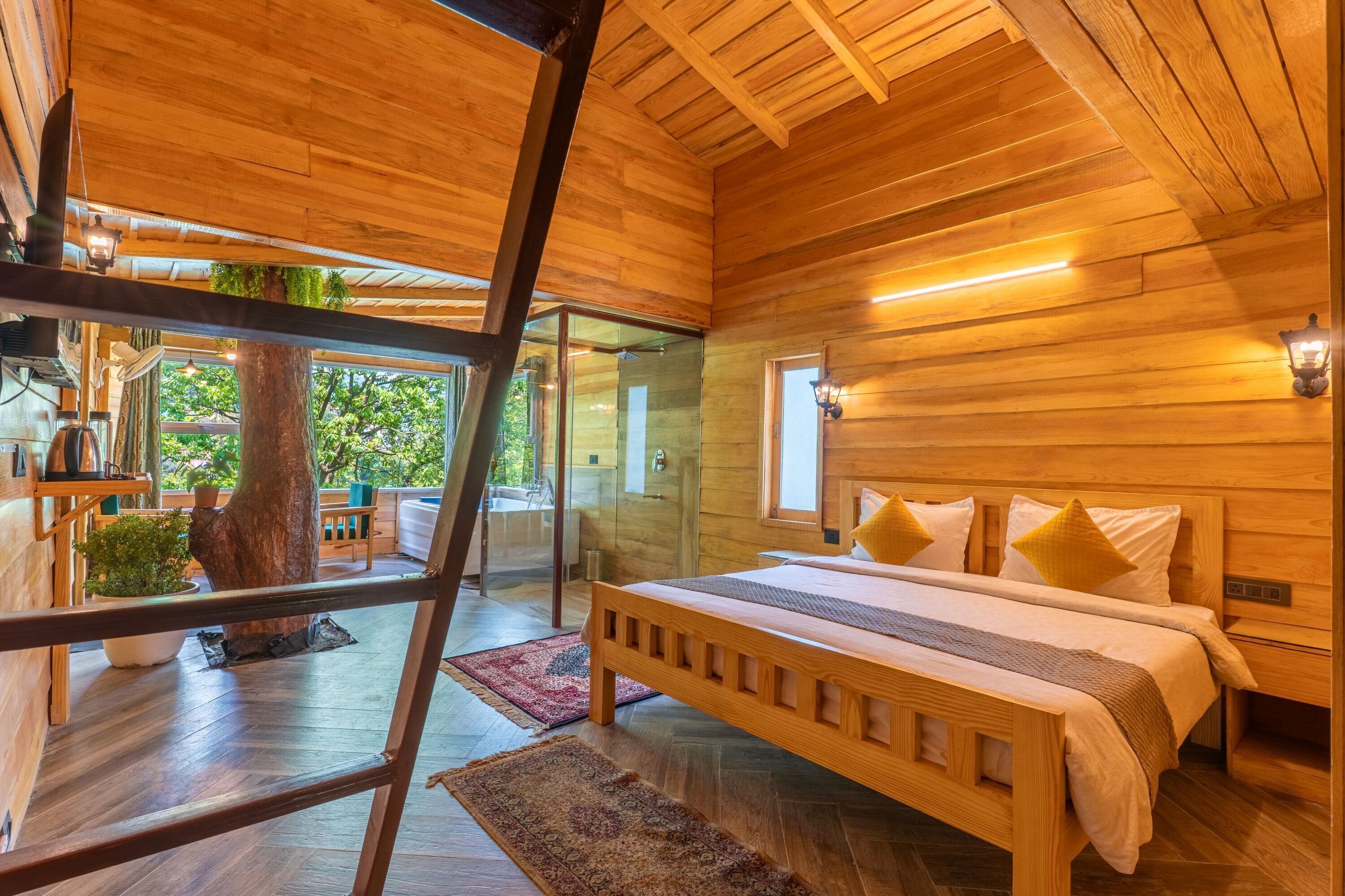 A wooden interior with a bed, a glass door leading outside, and a wooden ceiling.