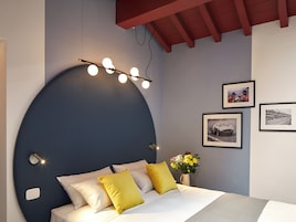 Deluxe Double Room, Courtyard View | In-room safe, desk, laptop workspace, blackout drapes