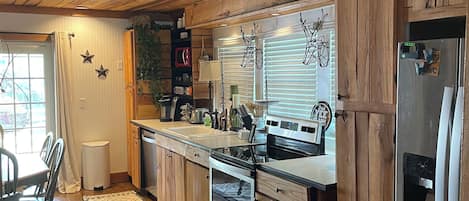 Enjoy cooking in this well-equipped kitchen with an oven, dishwasher, and refrigerator.