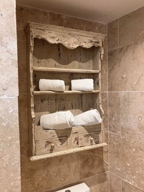 Shower, hair dryer, towels, toilet paper