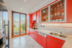 Apartment, Multiple Beds, Patio, Mountain View (Sopra il Lago 4) | Private kitchen | Fridge, microwave, oven, stovetop - 3 Bedroom Italian Lakes Apartment (Brezzo di Bedero)