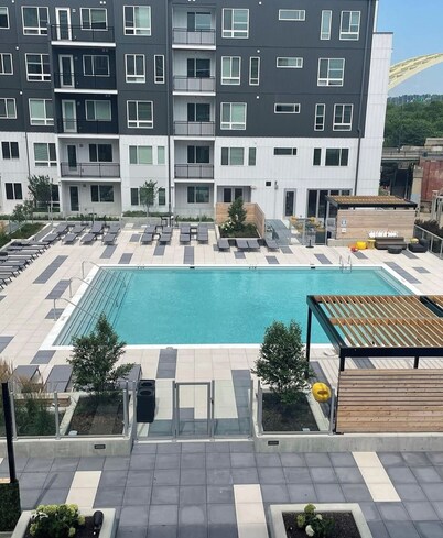 The 513 Flat! Pool & River View! Free Gated Parking! Walk to Banks & Stadiums!