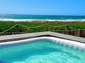 A pool with a view of the ocean.