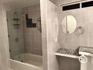 Shower, hair dryer, towels