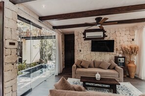 Villa, Multiple Beds, Balcony | Living area | 42-inch flat-screen TV with digital channels