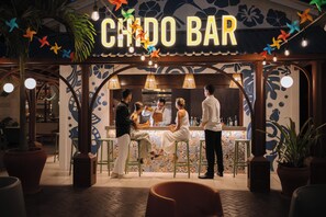 A Chido Bar with a tiled wall, bar area, and seating. - Bahia Principe Escape Tequila - Adults Only All Inclusive - Brand New Hotel (Akumal)