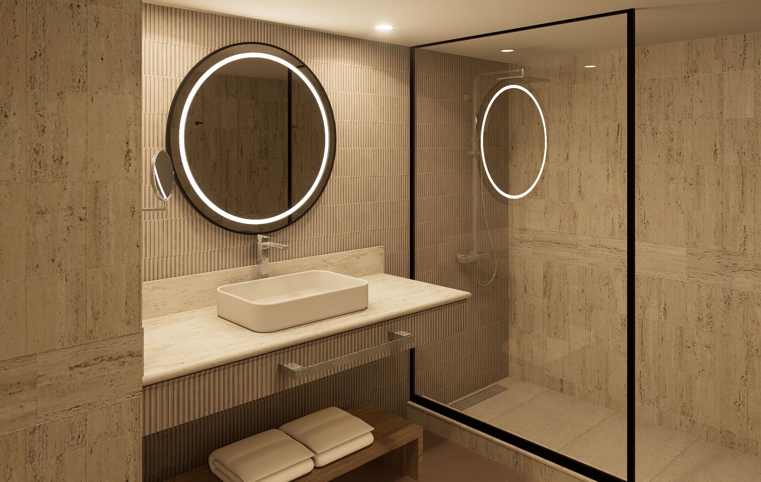 Un baño moderno con un espejo grande, un lavabo rectangular y una cabina de ducha de vidrio.