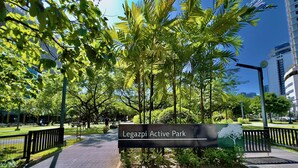 Legazpi Active Park with a paved walkway, trees, and a sign. - KL Tower - Cozy 1BR Deluxe with Balcony near Greenbelt Mall (Makati)