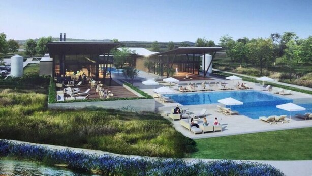 A modern resort with a large pool area, outdoor seating, and a covered lounge. - Cozy Apartment in Austin by The Key Rentals (Austin)