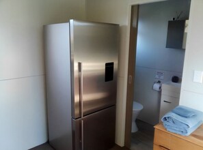 Interior - Cozy Matarangi cabin. Enjoy the gardens and lake views from your private deck. (Matarangi)