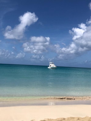 Beach nearby, white sand, beach towels