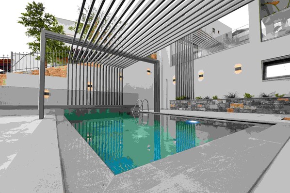 A modern outdoor pool area with a metal pergola, a stone wall, and a small garden. - MGK Complex Suite Private Pool Ground Floor (Malevizi)
