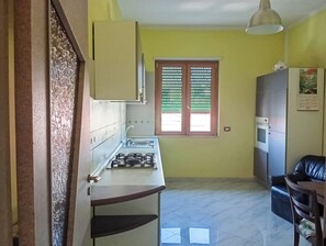 Apartment, Balcony | Private kitchen | Coffee/tea maker