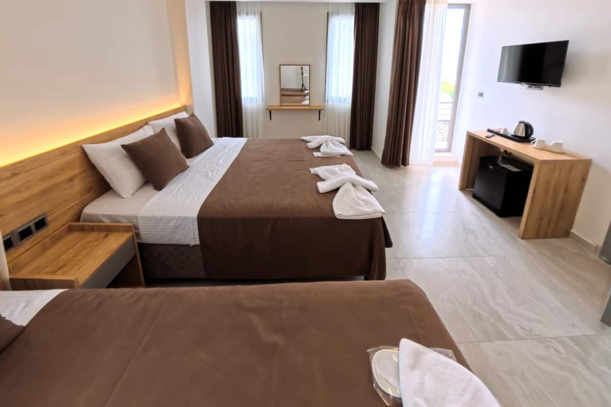 Family Quadruple Room, Balcony, Garden View | Egyptian cotton sheets, premium bedding, in-room safe, desk
