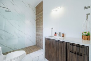 Shower, towels, soap, toilet paper