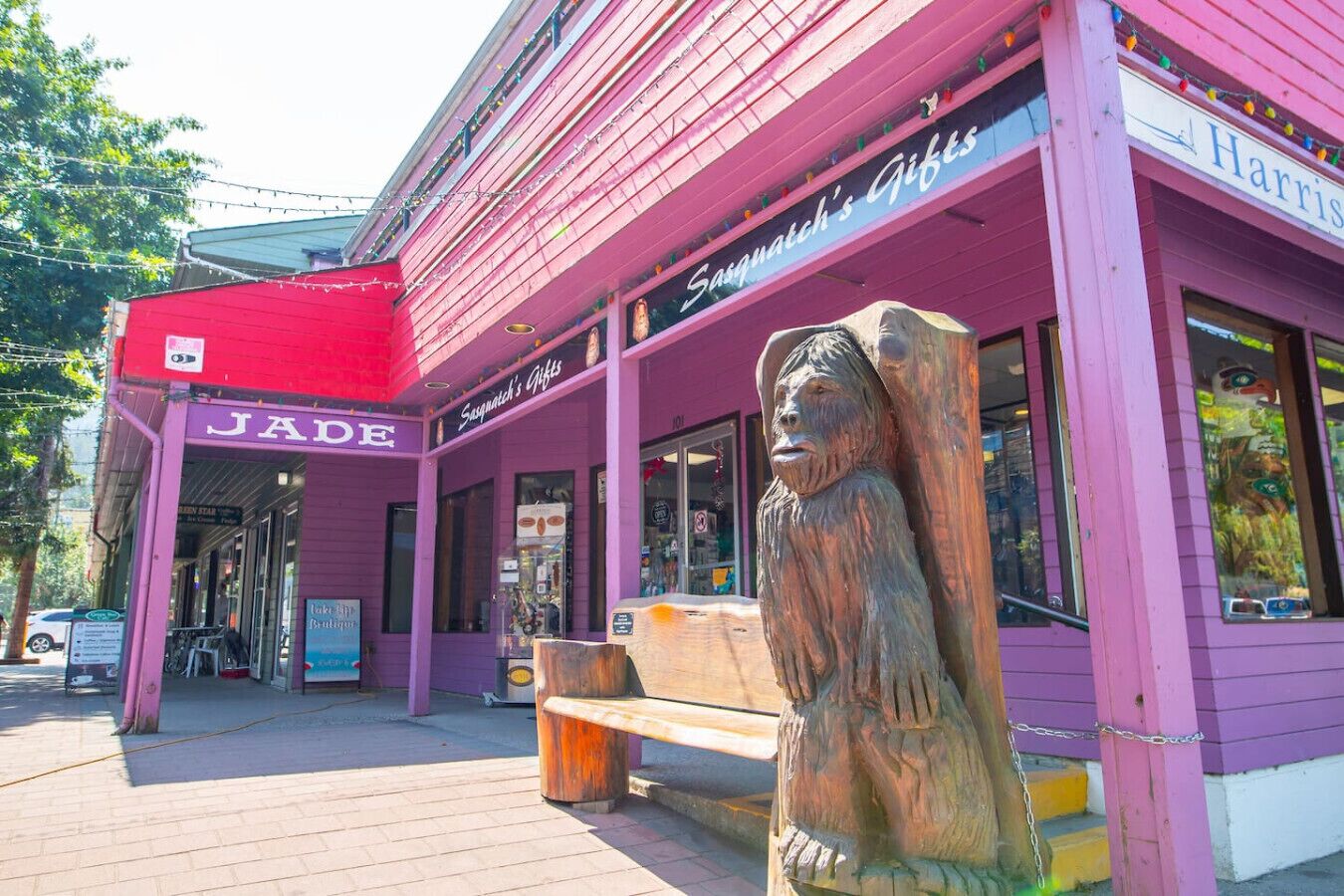 A building with a purple facade and a red awning labeled "JADE".