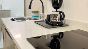 Fridge, microwave, stovetop, coffee/tea maker