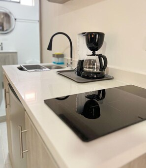 Fridge, microwave, stovetop, coffee/tea maker