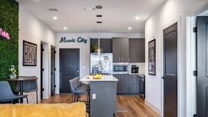 Two-Bedroom Apartment with Balcony | Private kitchen | Coffee/tea maker, cleaning supplies
