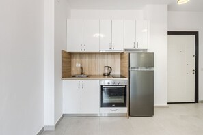 Fridge, microwave, cookware/dishes/utensils, dining tables