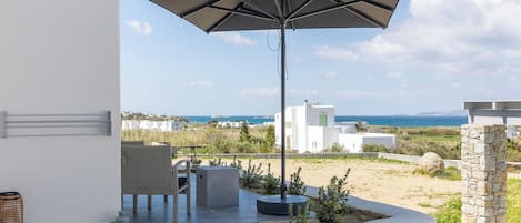 Habitación doble, vista al mar | Terraza o patio