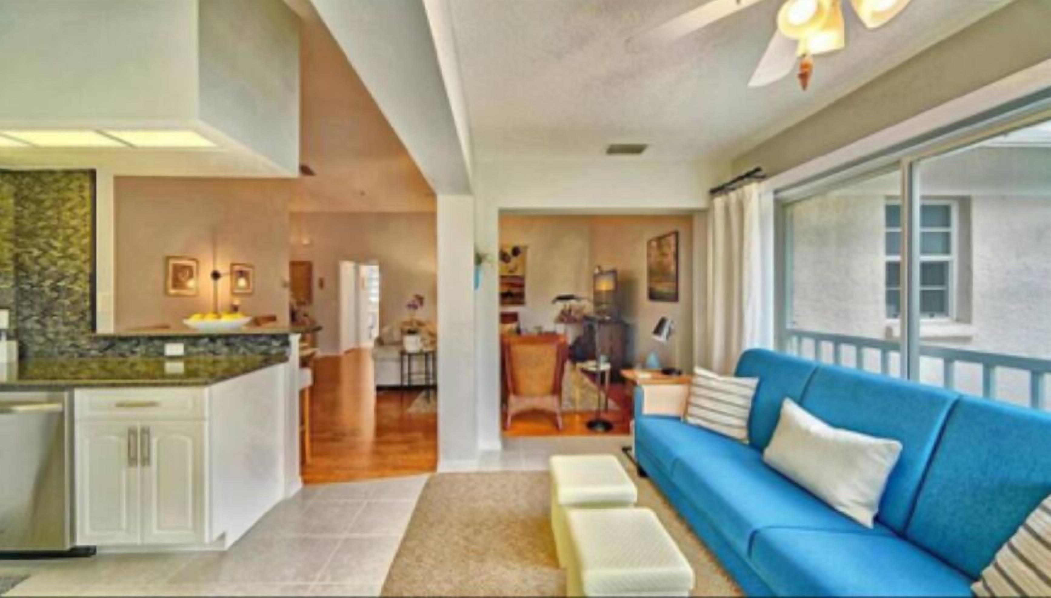 A modern interior with a kitchen, dining area, and living room.
