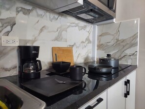 Fridge, microwave, stovetop, coffee/tea maker