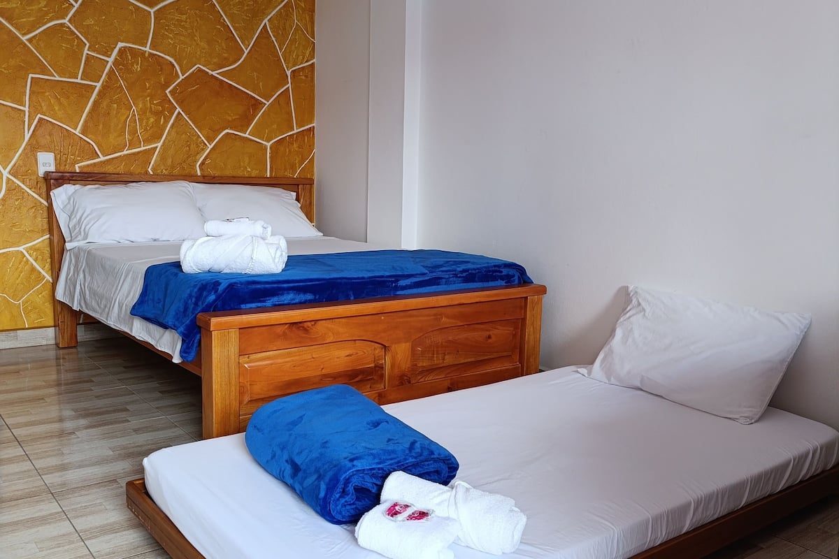 Family Triple Room, Patio, Pool View | Desk, free WiFi