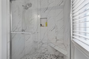 Shower, towels, soap, toilet paper