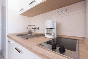 Fridge, microwave, stovetop, coffee/tea maker