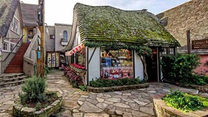 A quaint village street with a small shop named 'Village of Sweets' selling imported English chocolates. - Modern Cozy Pebble Beach Studio with Premium Amenities and WiFi (Del Monte Forest)