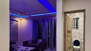 Executive Apartment | Living area | 52-inch flat-screen TV with digital channels, TV
