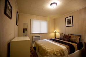 Enjoy a comfortable stay in this well-appointed room with a single bed, bedside table, and soft lighting.