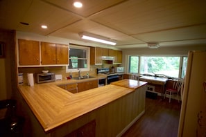 Enjoy cooking in this well-equipped kitchen with a central island and ample counter space.