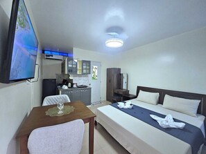 Deluxe Studio, Pool View | In-room safe, blackout drapes, iron/ironing board, free WiFi