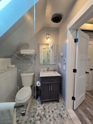 Shower, hair dryer, towels, soap