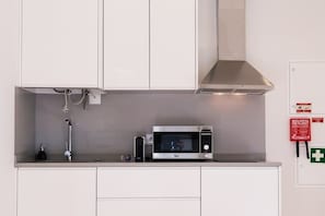 Fridge, microwave, stovetop, coffee/tea maker