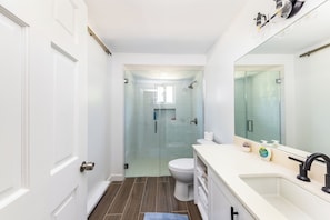 Shower, hair dryer, towels, soap