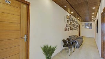 Deluxe Double Room, Mountain View | Living area | TV