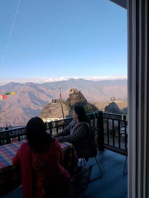 A restaurant with a view of mountains.