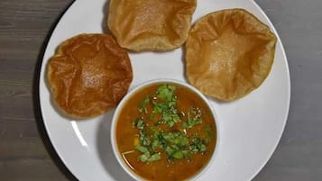 Daily cooked-to-order breakfast (INR 300 per person)
