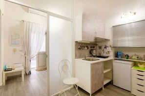 Fridge, microwave, stovetop, coffee/tea maker