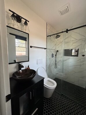 Shower, towels, soap, toilet paper