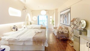 A modern bedroom with a large bed, bedside tables, a dresser, and a mirror. - Xi'an Hills Lostwine Boutique Retreat (Xi'an)