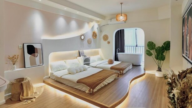 A modern bedroom with a curved wooden platform bed, a bathtub, and a large window. - Xi'an Hills Lostwine Boutique Retreat (Xi'an)