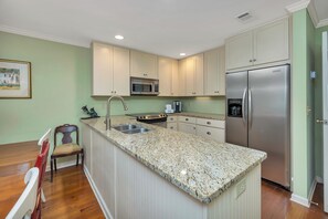 Fridge, microwave, stovetop, dishwasher - Great townhome, across the street from the beach. (Saint Simons Island)